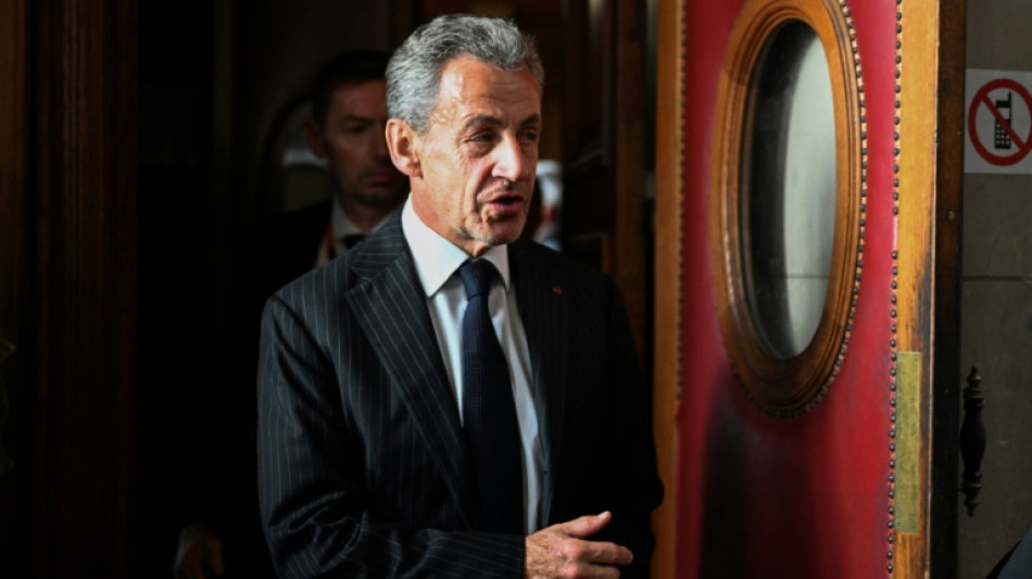 French court confirms Sarkozy conviction, softens sentence