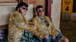 Sideburns, sweat and blue suede shoes on Australia's Elvis train