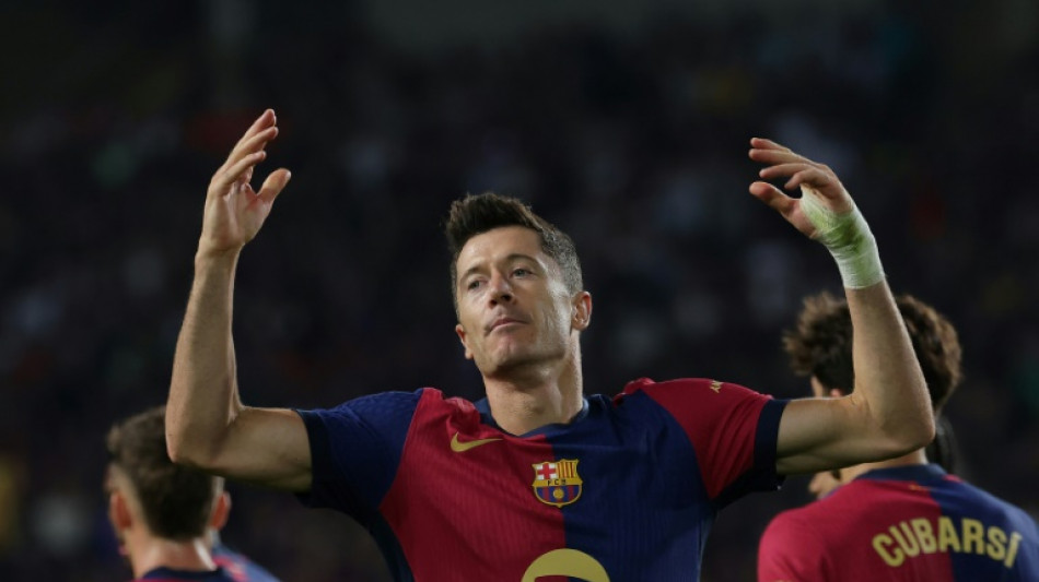 Lewandowski helps Liga leaders Barca past Getafe