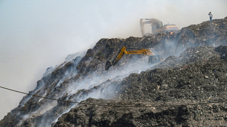 Choking and sweating around Delhi's burning hill of trash