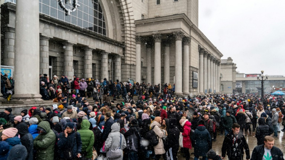 Displaced Ukrainians pack trains to western border