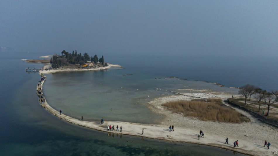 Lake Garda tourists flock to island reconnected by drought