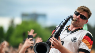 German fans dance to the tune of the 'saxophone guy'