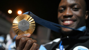 Flags and dancing as Botswana welcomes home Olympic gold